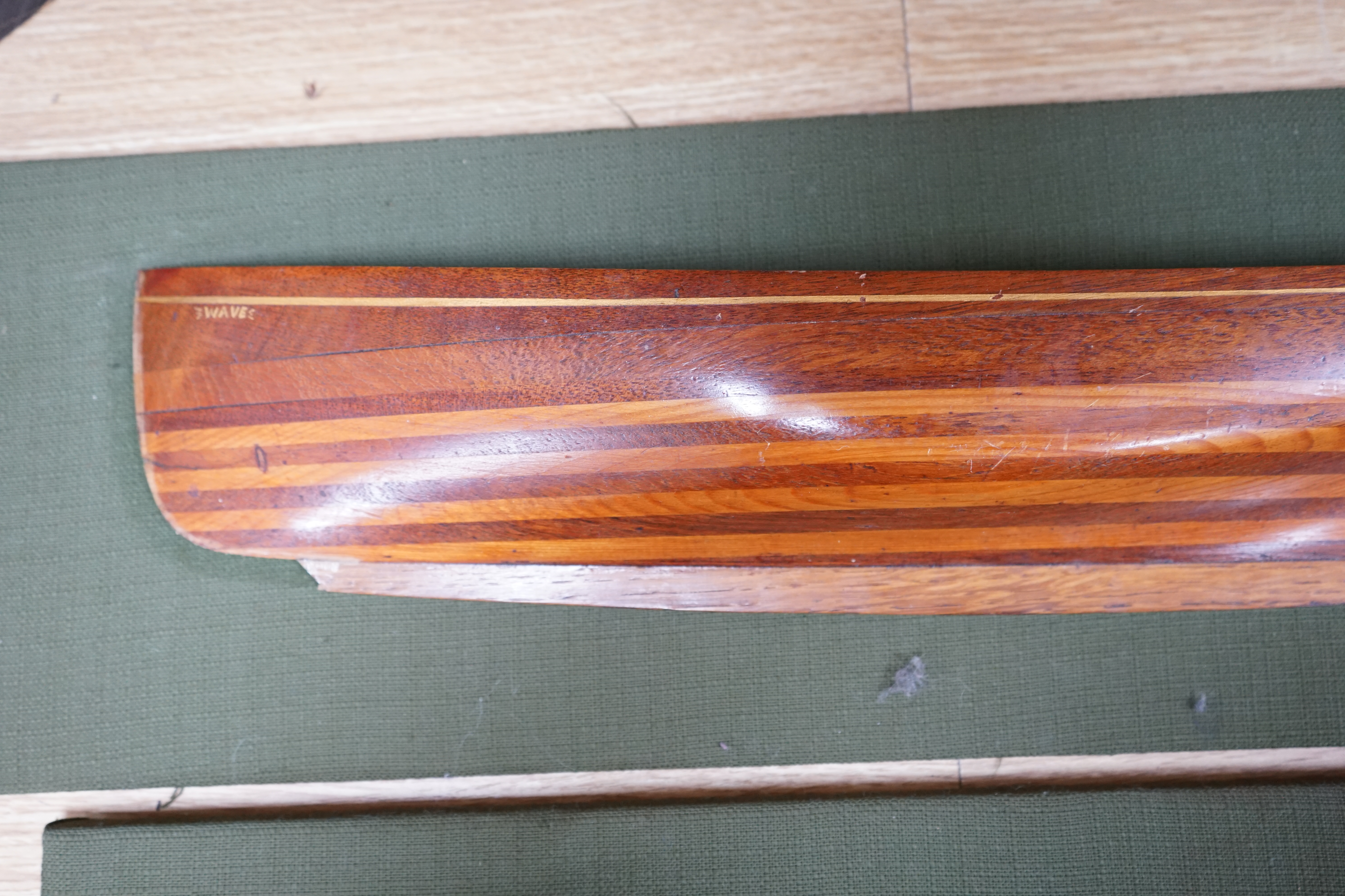 Two mounted cross banded mahogany and yew wood split hull models. Condition - fair to good